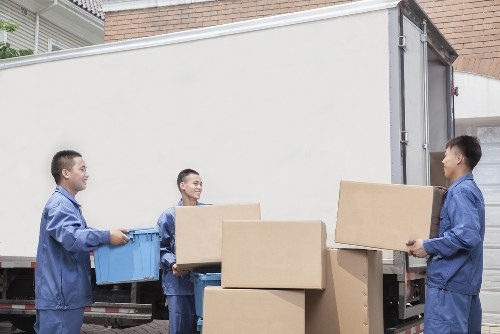 Packed boxes and furniture ready for collection in Pimlico
