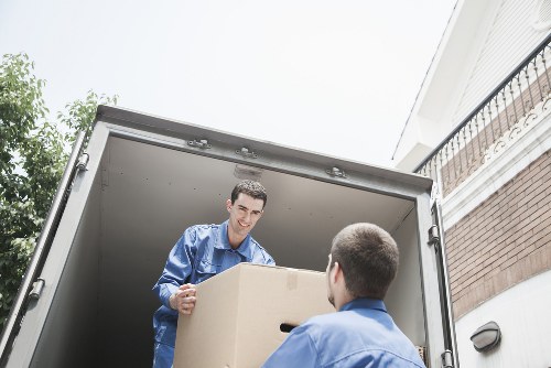 Packed moving boxes and wrapped furniture ready for a local Pimlico move